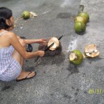 Chopping young coconuts